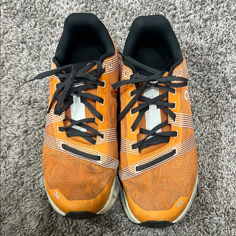 On Running Orange and Black Athletic Shoes